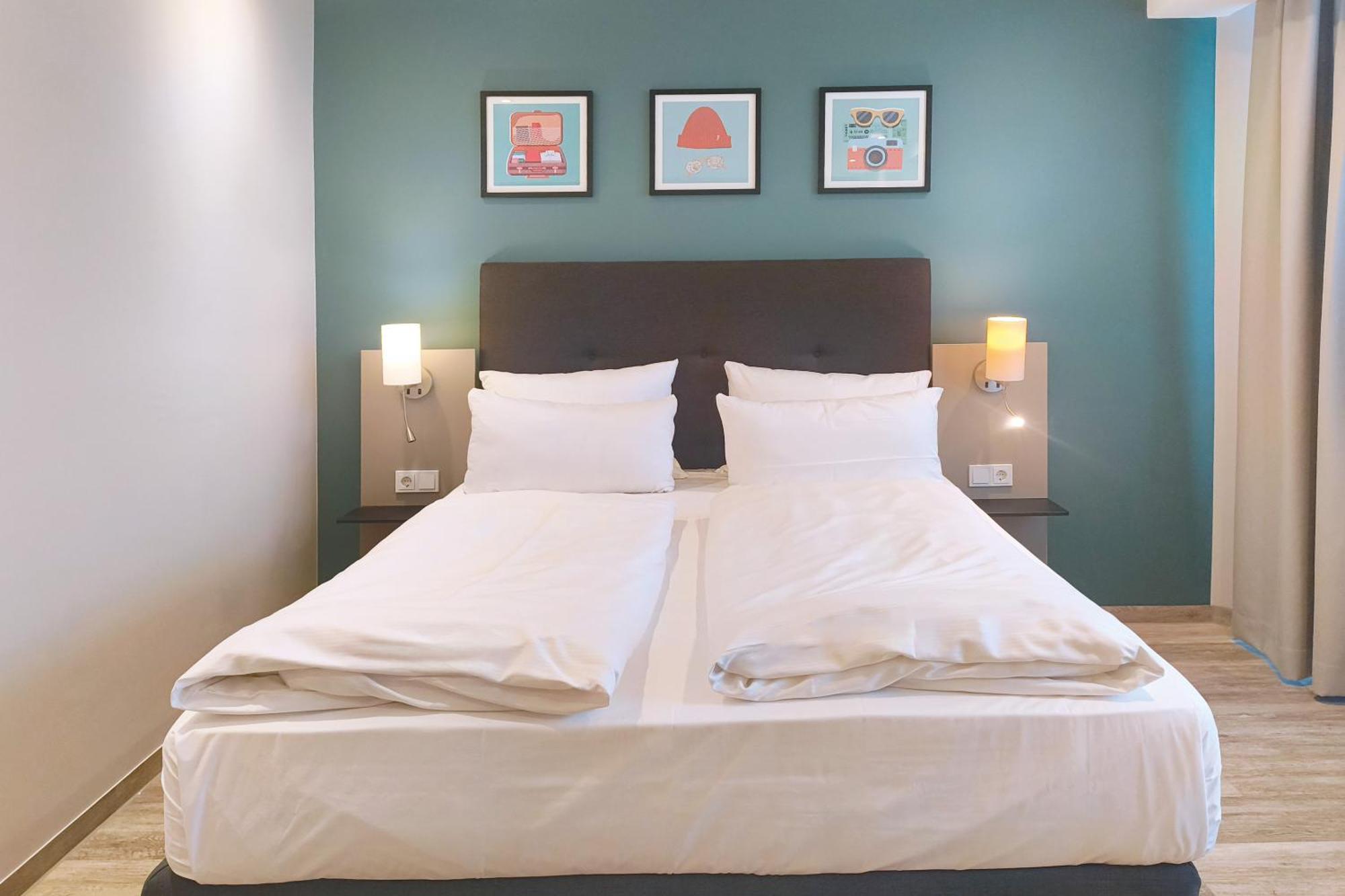 Premium Familienzimmer mit 1 Queensize-Bett und 2 Einzelbetten